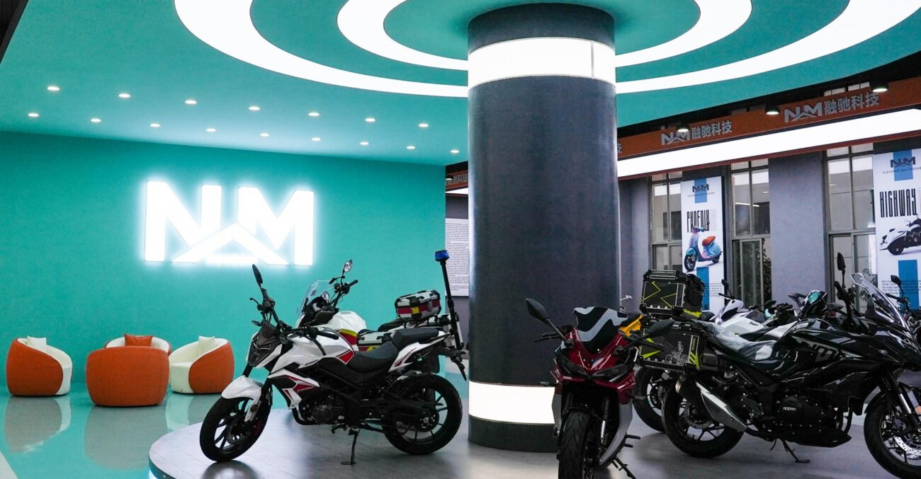 Nooma motorcycle showroom displaying various models in modern exhibition hall.