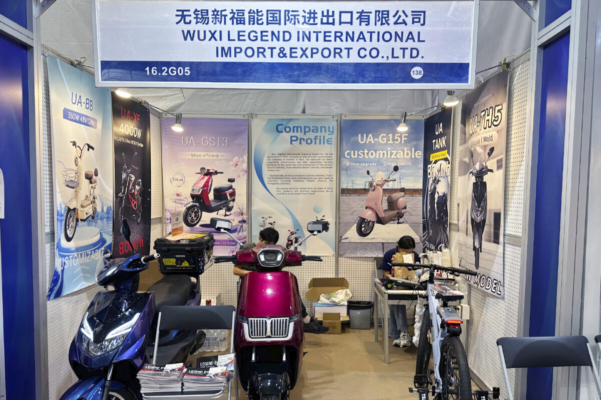 Legend EV delivery electric scooter uses a rear cargo box and a front footboard cargo area to improve courier efficiency
