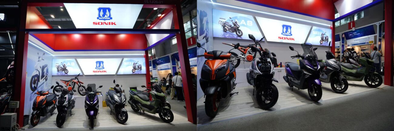SONIK International booth hosting buyer consultations beside a scooter